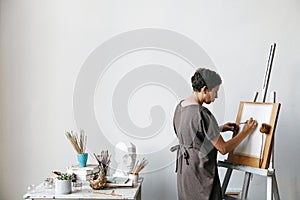Female artist in her spacious white studio