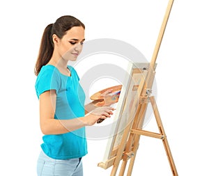 Female artist painting picture on white background