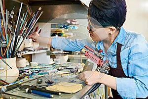 Female Artist Working with Glass