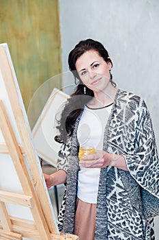 Female Artist Works on Abstract Oil Painting, Moving Paint Brush Energetically She Creates Modern Masterpiece.