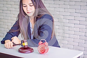 Female asian auctioneer control, holding wooden hammer, and offer bid winner auction highest bidder in final lift,business