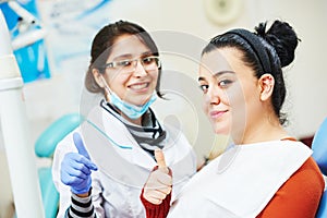 Female asian dentist doctor at work