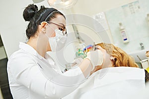 Female asian dentist doctor at work