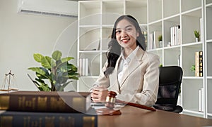 A female Asian lawyer reviews business and real estate laws. Legal consultants provide legal advice and guidance