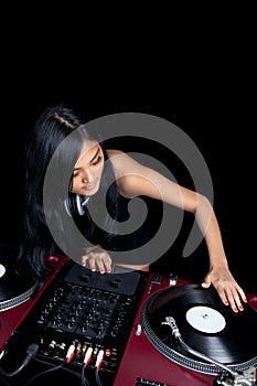 Female Asian mixing on turntables