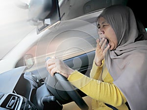 Female Driver Asleep While Driving a Car