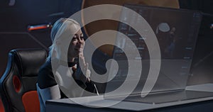 Female astronaut having a video call with family