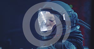Female astronaut looking around