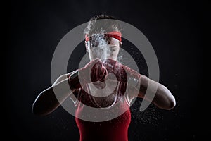 Female athlete in boxing bandages and sportswear photo