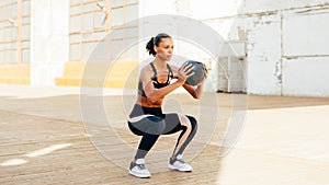 Female athlete doing squat exercises