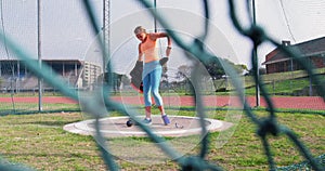 Female athlete getting ready for shot put game at sports venue 4k