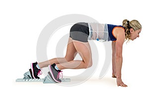 Female athlete in position ready to run