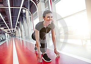 Female athlete in position ready to run. woman ready for sprint.