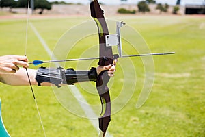 Female athlete practicing archery