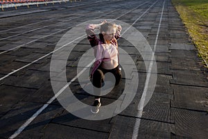 Female athlete preparing legs for cardio workout. Fitness runner doing warm-up routine. woman runner warm up outdoor. athlete