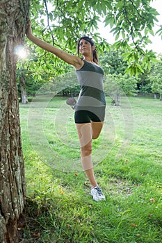 Female athlete stretching on camaldoli park