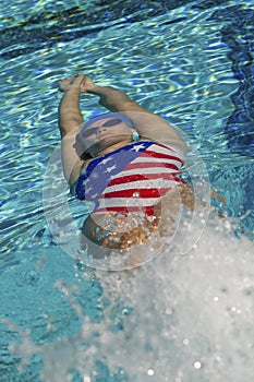 Female Athlete Swimming In Backstroke