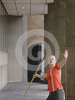 Female Athlete Throwing Javelin In Portico