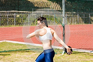 Female athlete about to throw a discus