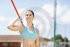 Female athlete about to throw a javelin