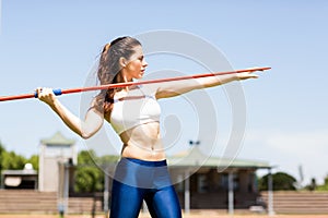 Female athlete about to throw a javelin