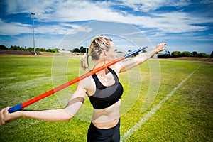 Female athlete about to throw a javelin