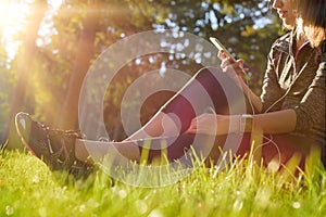 Female athlete using fitness app on her smart watch to monitor workout performance. Lifestyle wearable technology concept