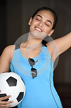 Female Athlete Winner With Soccer Ball