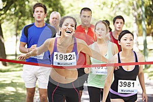 Female Athlete Winning Marathon Race