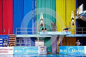 Female athletes perform syncronized jump