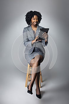 Female Author or Businesswoman Keynote Speaker with Tablet