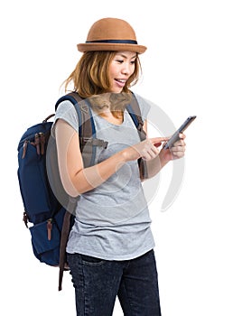 Female backpacker look at mobile phone