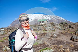 Female backpacker on the trek to Kilimanjaro mountain