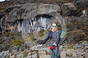 Female backpacker on the trek to Kilimanjaro mountain