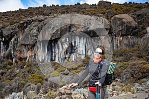 Female backpacker on the trek to Kilimanjaro mountain