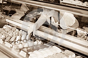 Female baker offering fresh pastry