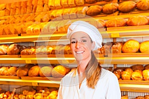 Female baker selling bread in bakery