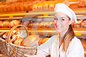 Female baker selling bread in her bakery