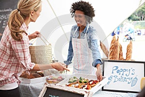 Female Bakery Stall Holder At Farmers Fresh Food Market photo