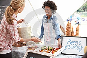 Female Bakery Stall Holder At Farmers Fresh Food Market