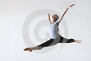 Female Ballet Dancer Leaping In Mid Air