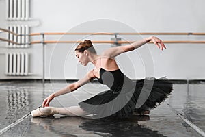 Female ballet dancer posin on rehearsal