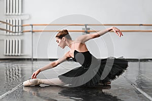 Female ballet dancer posin on rehearsal photo