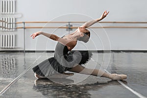 Female ballet dancer posin on rehearsal photo