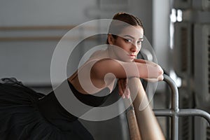 Female ballet dancer resting after rehearsal photo