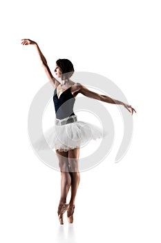 Female ballet dancer wearing tutu. Prima ballerina posing on white background photo