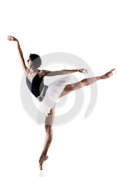 Female ballet dancer wearing tutu. Prima ballerina posing on white background photo