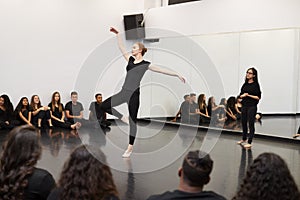 Female Ballet Student At Performing Arts School Performs For Class And Teacher In Dance Studio