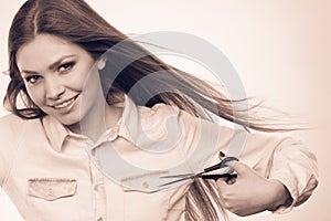 Female barber with trimmers scissors. photo