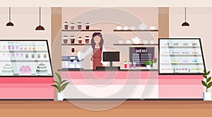 Female barista coffee shop owner smiling woman standing behind bar counter modern cafeteria interior flat horizontal